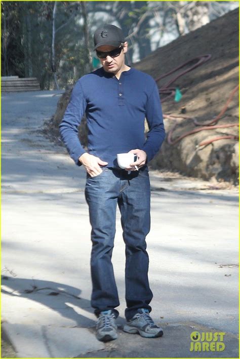 Jeremy Renner goes incognito in a cap and sunglasses while enjoying his morning coffee on ...