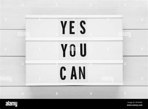 Lightbox with phrase Yes You Can on white wooden table, top view. Motivational quote Stock Photo ...