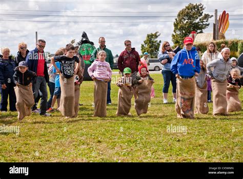 Kids in the potato sack race at the annual Scarecrow Festival held in Summerside, Prince Edward ...