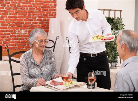 Senior couple being served food hi-res stock photography and images - Alamy