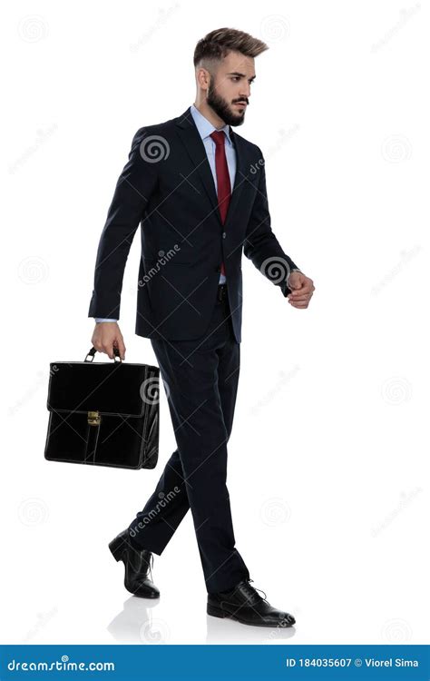 Young Businessman Holding Suitcase and Walking Stock Image - Image of body, business: 184035607