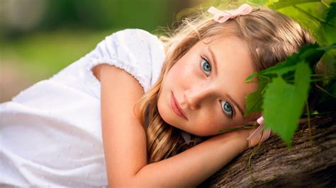 Ash Eyes Cute Little Girl Is Lying On Tree Trunk Wearing White Dress In ...