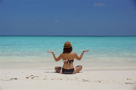 Woman in Black and White Bikini Sitting on White Stand Facing Beach during Daytime · Free Stock ...