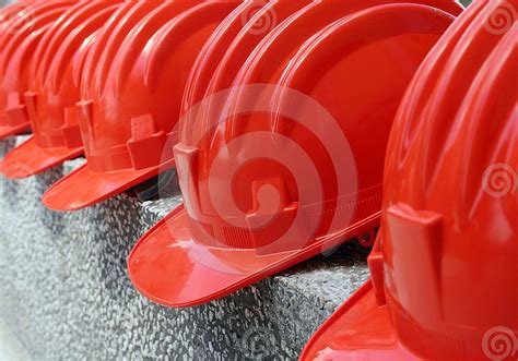 red protection helmets (hard hats) in a row - find it here: http://www.dreamstime.com ...