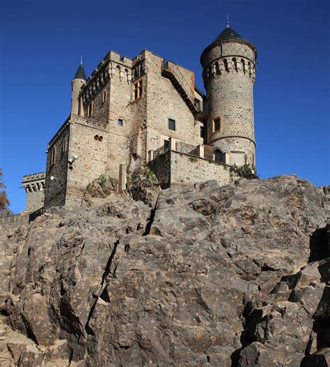 The Château de La Roche stands on an island in the lake formed by the ...