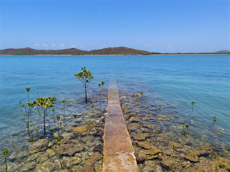 At the very tip of Cape York where the South Pacific Ocean and the ...