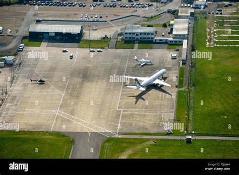 An aerial view of aircraft parked on the apron of Coventry Airport ...