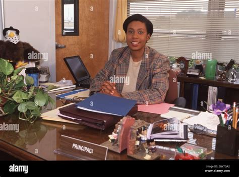 Female school principal desk hi-res stock photography and images - Alamy