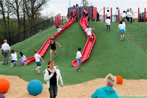 children are playing on an artificial playground