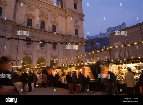 Christmas market at Cathedral Square near Salzburg Cathedral in the evening Salzburg Salzburg ...