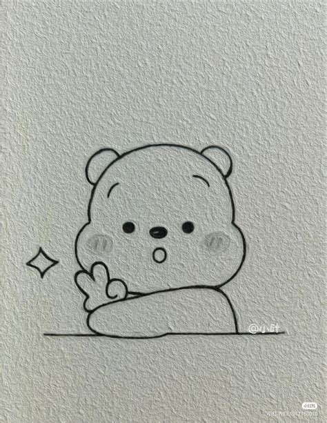 a drawing of a teddy bear sitting on top of a table