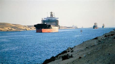 In pictures: Container ship blocking the Suez Canal finally on the move - BBC News