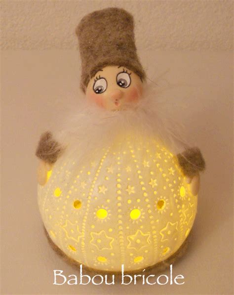 a light up ball with a small doll on top