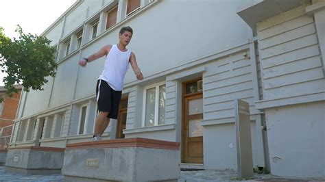 Young athlete performing parkour trick 29131575 Stock Video at Vecteezy