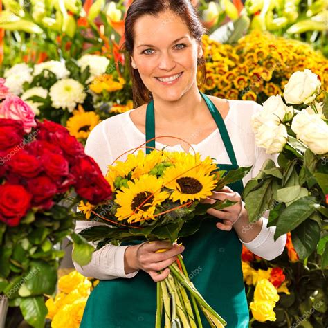 Smiling florist woman bouquet sunflowers flower shop — Stock Photo © CandyBoxImages #19857799