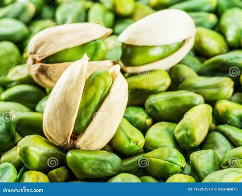 Green Pistachio Nut with Shell Over Lot of Pistachios. Stock Image ...