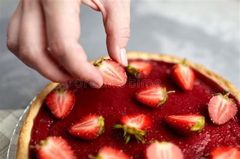 Strawberry Tart Decoration. Hand Accurately Puts a Half of a Berry on ...