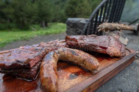 Typical Uruguayan and Argentine Asado Cooked on Fire. Entrana and Vacio ...