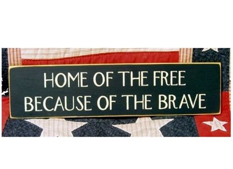 Home of the free because of the brave wood sign