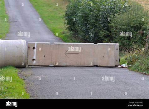 Concrete road block Stock Photo - Alamy