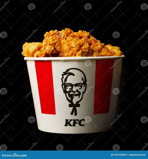 A Lots Of KFC Chicken Hot Wings Or Strips In Bucket Of KFC Kentucky ...