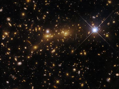 Hubble captures collision between two galaxy clusters merging to form a ...