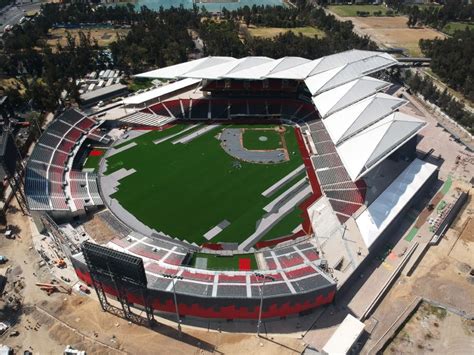 an aerial view of a baseball stadium with red and white markings on the field, surrounded by ...