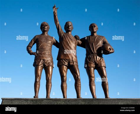 Statues of Sir Bobby Charlton, George Best and Denis Law statue at Old Trafford, Manchester ...