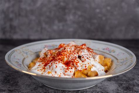 Turkish Manti on Plate with Yogurt, Sauce, Red Pepper, Mint Stock Photo ...