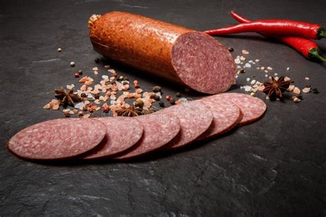 Big Chunk of Smoked Cervelat Pepperoni Sausage with Two Chili Stock Image - Image of product ...