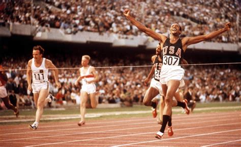 US athlete Tommie Smith (#307) crosses the finish line in first place, in the final of the Men's ...