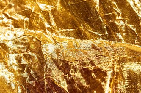 Premium Photo | Gold background with fabric texture