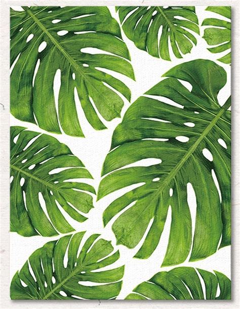 a green leaf pattern on white paper with the words,'tropical palm leaves