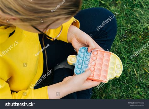 Top View Child Playing Colorful Poppit Stock Photo 2000059370 | Shutterstock