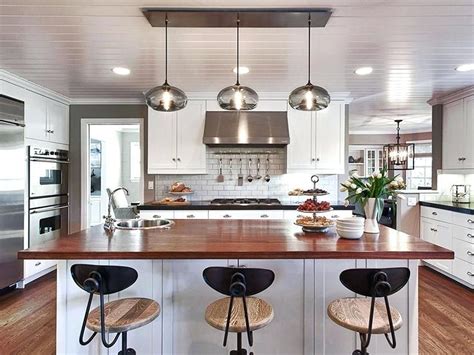 Pendant lighting over kitchen island dazzling lights above a white ...