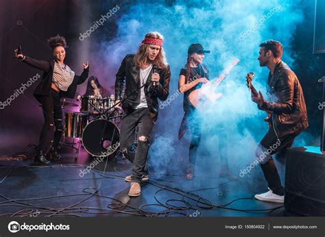 Rock band on stage — Stock Photo © TarasMalyarevich #150804922