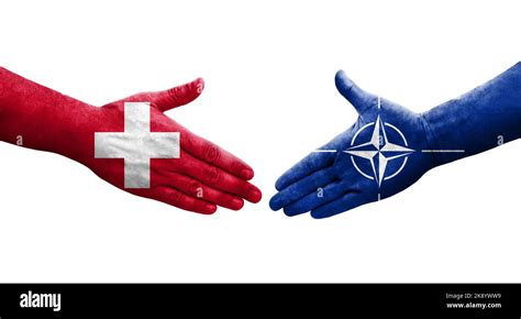 Handshake between Switzerland and Nato flags painted on hands, isolated ...