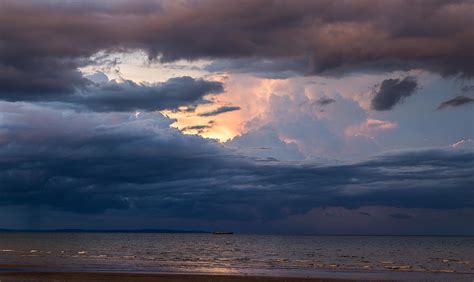 Looming Clouds Photograph by Lik Batonboot - Fine Art America