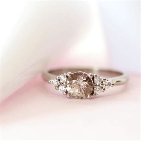 Our NEW Emma engagement ring will take your breath away 😮 Two clusters of small diamonds frame ...