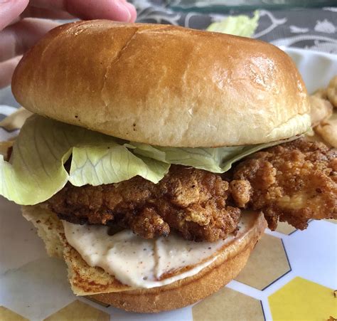 Homemade spicy fried chicken sandwich! Featuring my fingers lovingly caressing the brioche bun.