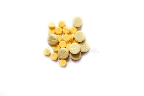 Closeup of Yellow Tablet on Isolated White Background. Tablets of Different Shapes and Sizes ...