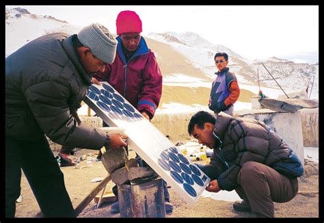 Barefoot solar engineers installing power system | Solar ene… | Flickr