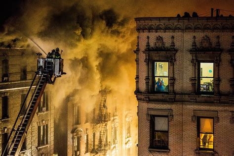 Man Arrested in Upper Manhattan Building Fire That Displaced Dozens - The New York Times