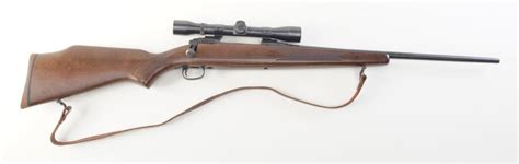 Savage Model 110 bolt action rifle, .30-06 cal., 22” barrel, black finish, checkered wood stock with