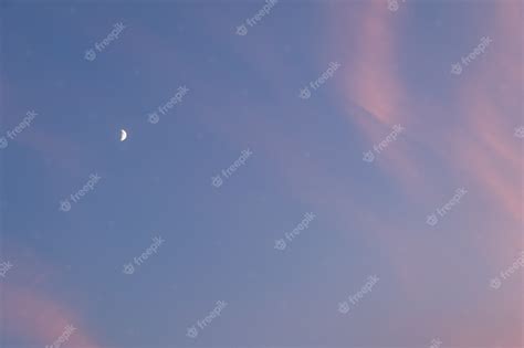 Premium Photo | Moon in the evening sky with clouds