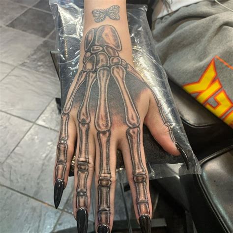 30 Cool Skeleton Hand Tattoos