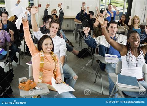 Students Raising Hands In The Classroom Stock Image - Image: 29648141