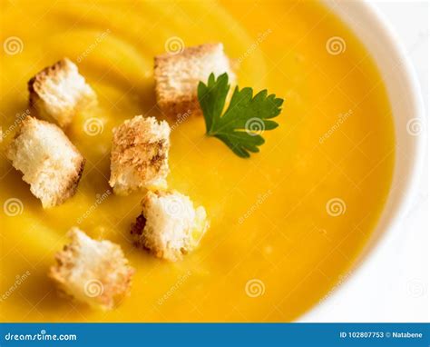 Pumpkin Soup With Croutons And Herbs In A White Cup Stock Image - Image ...