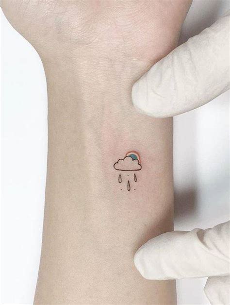 Rainy cloud and rainbow tattoo.