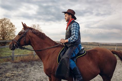 Cowboy riding a horse on texas farm Stock Photo by NomadSoul1 | PhotoDune